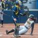 Iowa's Michelle Zeller slides in to home during the forth inning bringing the score to 2-0 in favor of Iowa.
Courtney Sacco I AnnArbor.com